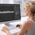 Woman designing 'DoubleMouse' logo on a desktop computer